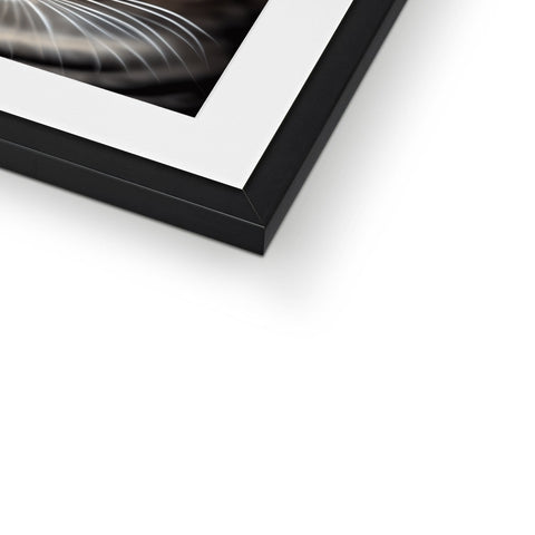 A close up of a picture frame on a black frame.