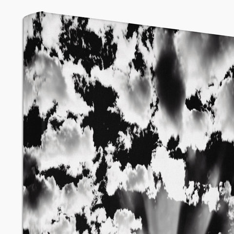 A couple of clouds floating on top of a black and white screen.