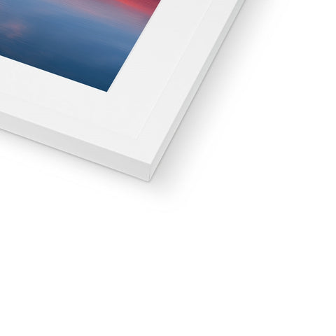 An imac photo is visible on a picture frame in a frame.