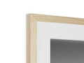 A picture frame that is in a white frame of wood hanging on a wall.