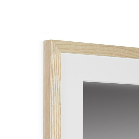 A picture frame that is in a white frame of wood hanging on a wall.