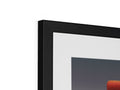 This close up image of a television is in a picture frame.