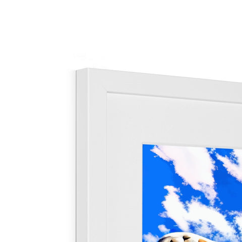 A framed picture of a picture frame set on top of a wall in front of some