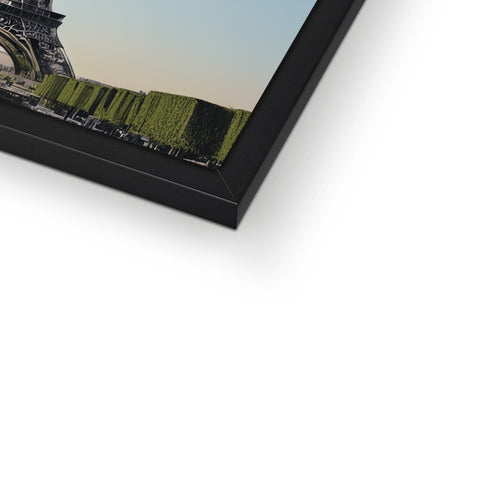 A picture of an image of the city of Paris is on a frame.