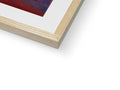 A picture of an art print sitting on top of a wooden frame.