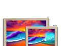 A wooden frame set up with three different pictures of three surfboards of different colors sitting
