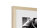 A wooden photo frame with a close up of the background of a shot by sitting on