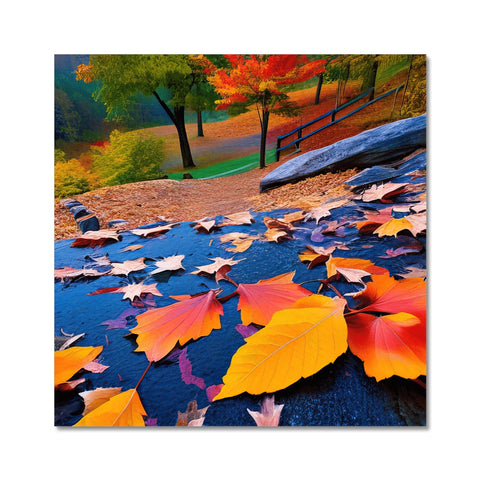 An art print of fall foliage is on a wall with a colorful tapestry.