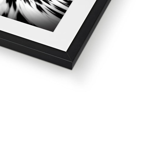 An abstract black and white picture on a black and gray metal frame.