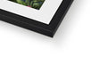 A picture frame in a white background with one image and another framed.