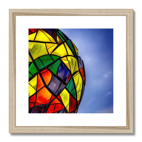 a framed picture of rainbow kites sitting in a beautiful stained glass dome next to a