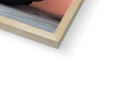 A wooden frame sits over top of a soft cover of a book.