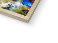 A glass book with an art print on the cover on a piece of wood.