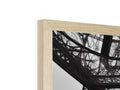 A picture frame with a close up of a mirror next to a wooden framed frame.