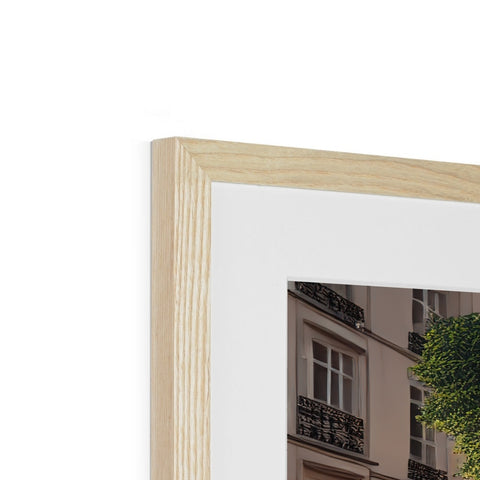 A picture frame with two white pictures inside the frame and a white photograph of a tree