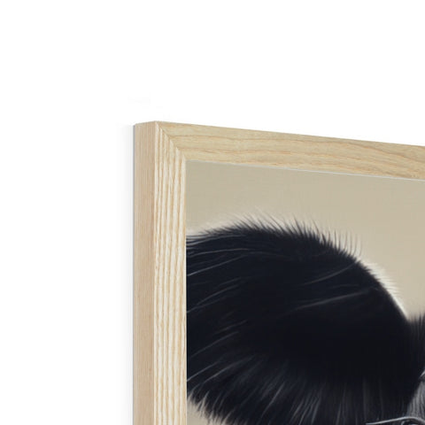 A picture frame featuring a cat on a mirror and hair on a pillow next to the