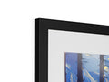 A picture frame is on the top of a wall containing three different colored prints.