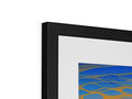 A black image of an abstract art print on a metal frame next to a blue mirror