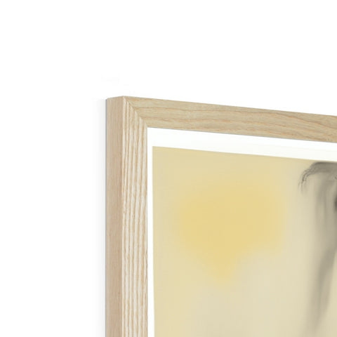 White painting of a tree in the background of a wood framed picture frame.
