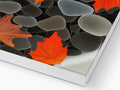A ceramic tile countertop with glass blocks on top of it that has autumn leafed