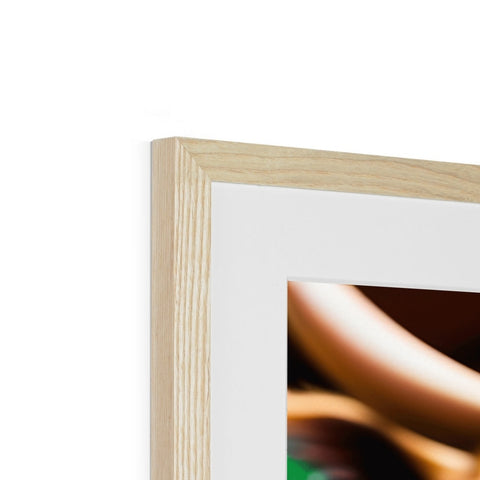 A photo frame is sitting on a wooden table, with a close up of a picture