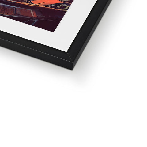 a picture frame in a frame in black and white  with a black and orange background