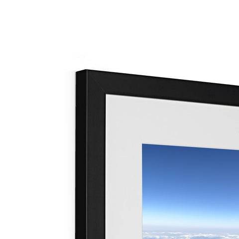 A photograph of a picture frame on the top of a flat screen tv.
