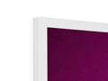 A purple bedspread on top of a flat panel TV.
