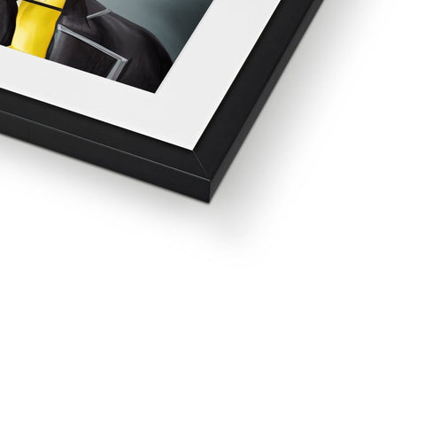 A yellow picture frame with a frame of a picture hanging in a corner of a room