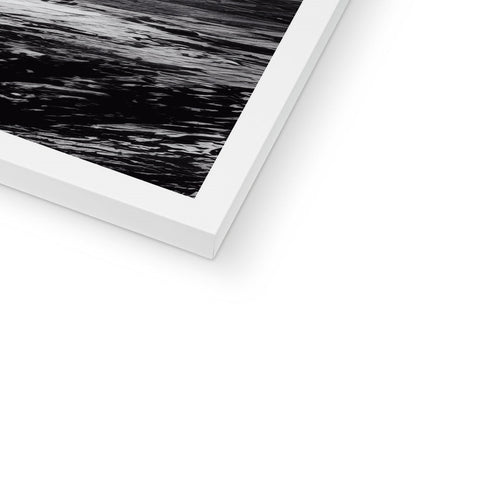 A black and white print of an abstract photo on a white picture frame.