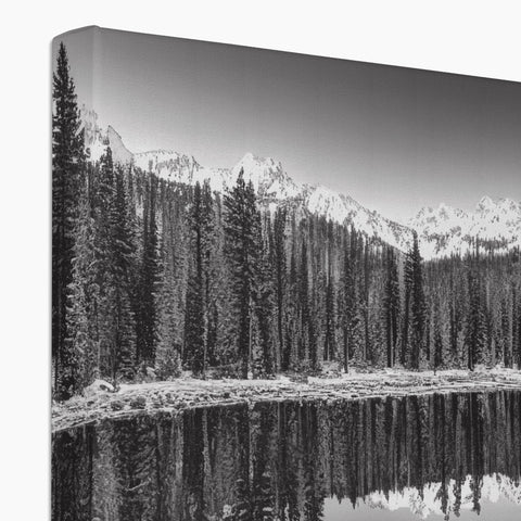 A flat panel print showing a snowy lake in the snow.