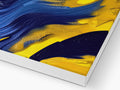 A blue and yellow art print on a wooden easel.