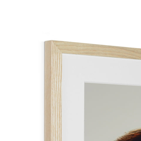 A wooden frame topped with a picture of a woman with a dog sitting in it.