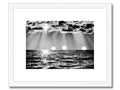 A black and white art print of some beach scenes with water out.