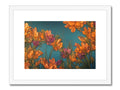 Art print with flowers on a white metal frame on a wall.