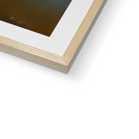 A photograph with art print is displayed on a wooden frame.