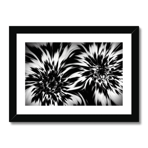 A black and white picture of flowers in an artwork photo frame.
