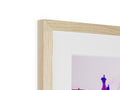 A photo frame has wood art prints on it with a photo of a picture,