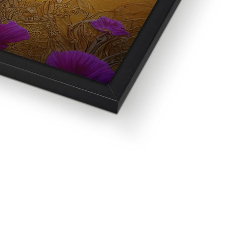 A gold picture of flowers in a frame and it's wrapped up in a metal frame