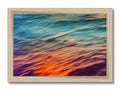 a wooden frame with ocean waves on top of it with colorful background