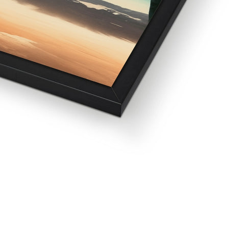 A flat panel picture is on top of a wooden frame with black wooden glass on top