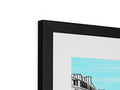An art print is hanging on top of a photo frame with a black picture.