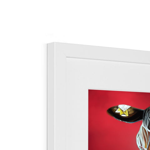 a photo of a bird sitting inside a red framed picture on a white wall