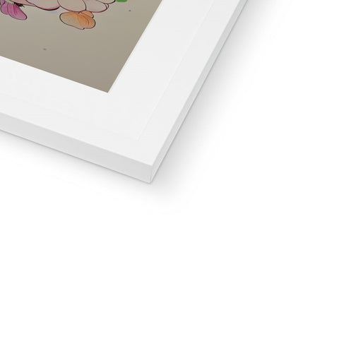 A white picture frame sits on the table with a print on top of it.