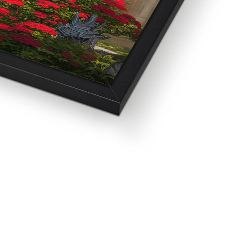 A framed photo of flowers is displayed in a red frame in front of a photo display
