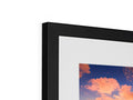 A white picture frame with an image that has multiple frames.
