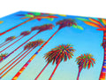 A colorful blanket with a black and white background and palm tree