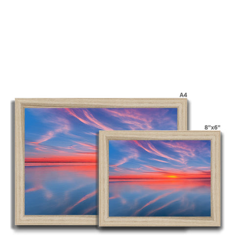 A wooden frame with three images on it sitting in a white background.