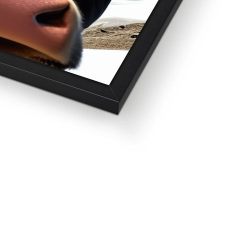 A picture above a picture frame with a close up of a picture that had fallen off