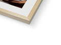 A picture of wood on a book shelf with a photograph in a picture frame